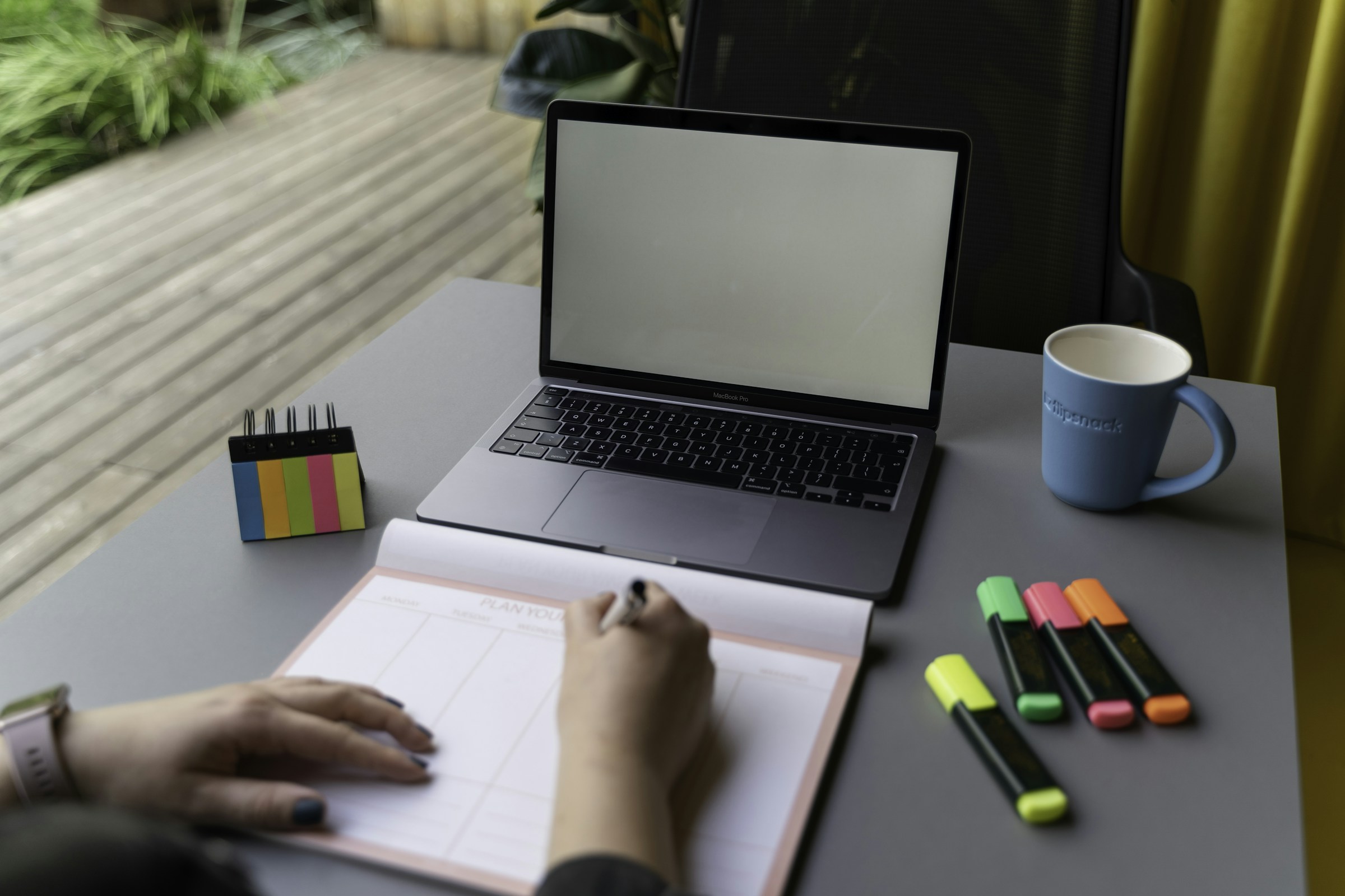 Career planning notes beside a laptop and desk supplies